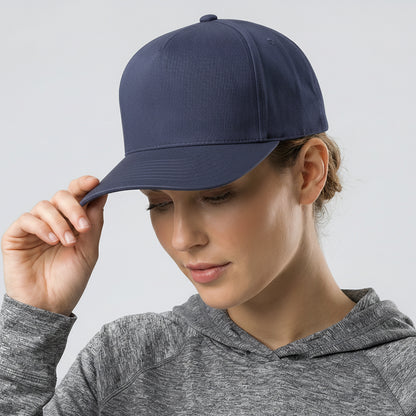 Person wearing a navy blue cap and gray hoodie against a light gray background