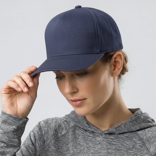 Person wearing a navy blue cap and gray hoodie against a light gray background