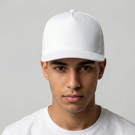 Person wearing a white cap and white shirt against a gray background