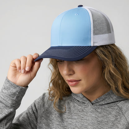 Person wearing a blue and white cap with a visible brand logo on a plain background