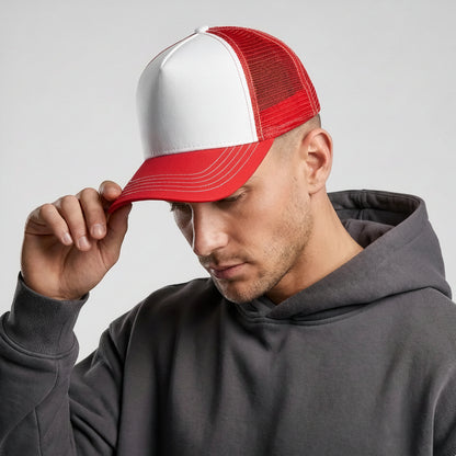 Man wearing a red and white cap with a gray hoodie on a light gray background