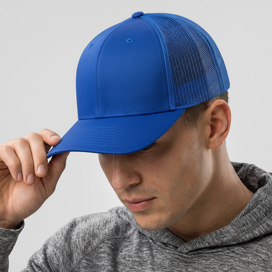 Person wearing a blue cap with a visible brand logo on a gray background