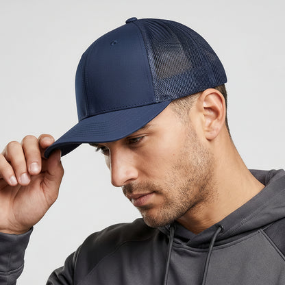 Man wearing a navy blue cap with a brand logo on a light gray background