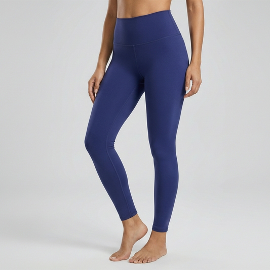 Blue leggings worn by a person on a white background