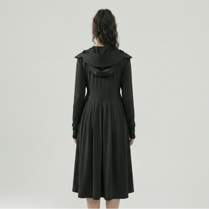Black hooded dress worn by a person on a white background