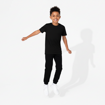 Child wearing a black outfit on a white background