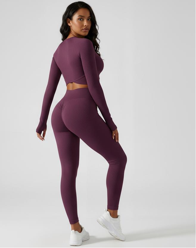 Woman wearing a purple athletic outfit on a white background